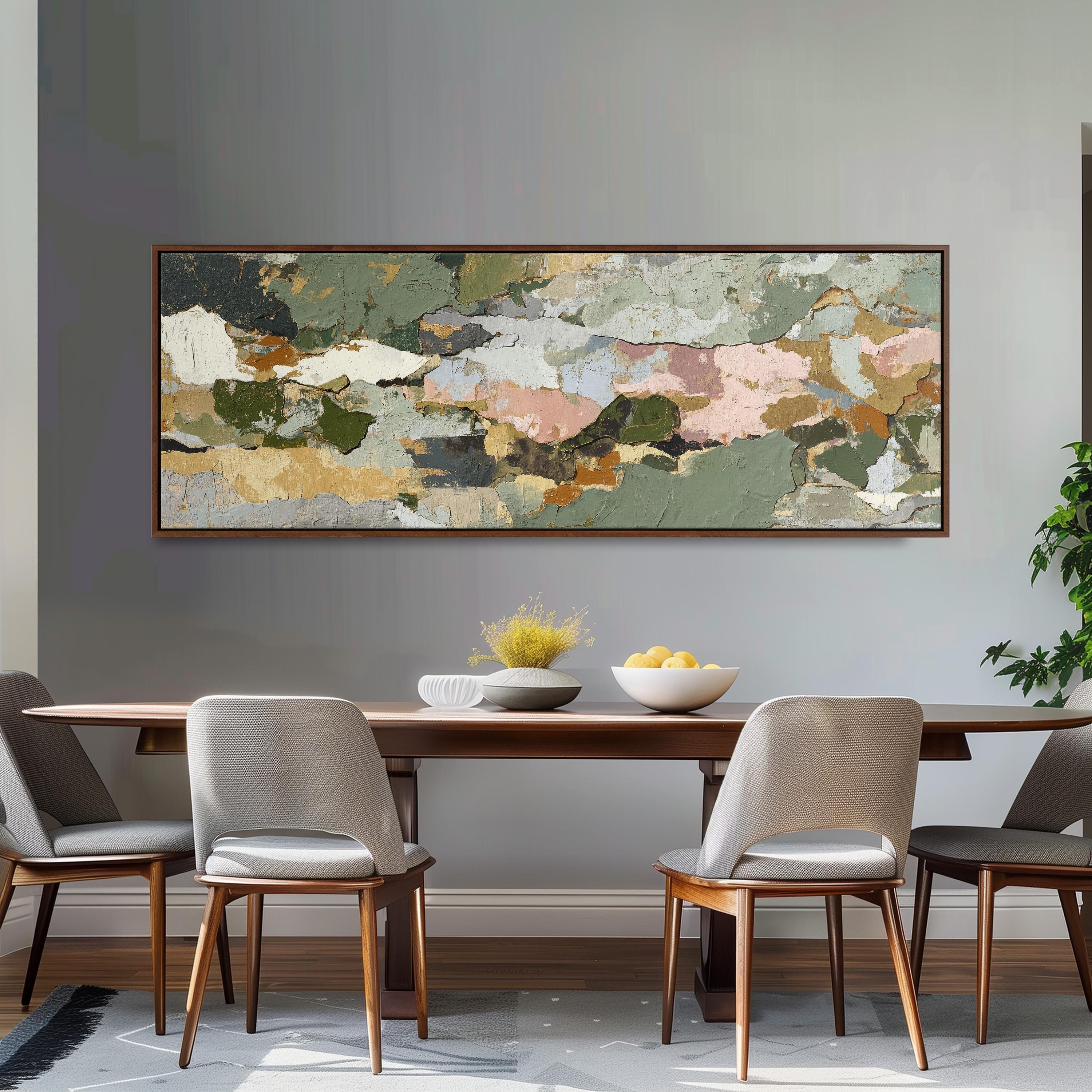 a dining room with a large abstract painting hanging on the wall above a wooden table with four chairs. The table is set with a bowl of fruit and a vase of flowers, creating a cozy and inviting atmosphere.