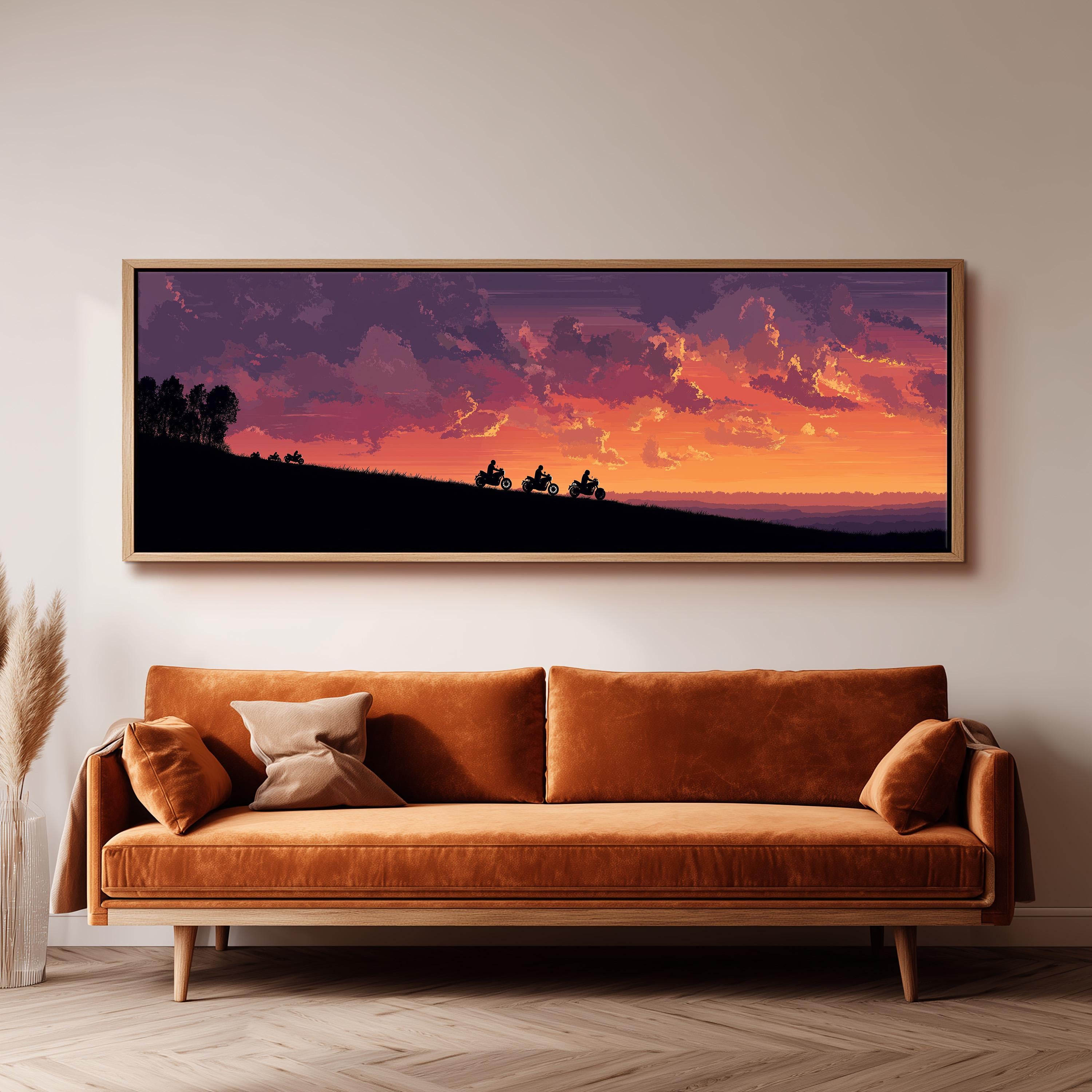 a large, framed painting of a sunset landscape hanging on a wall above a brown sofa.