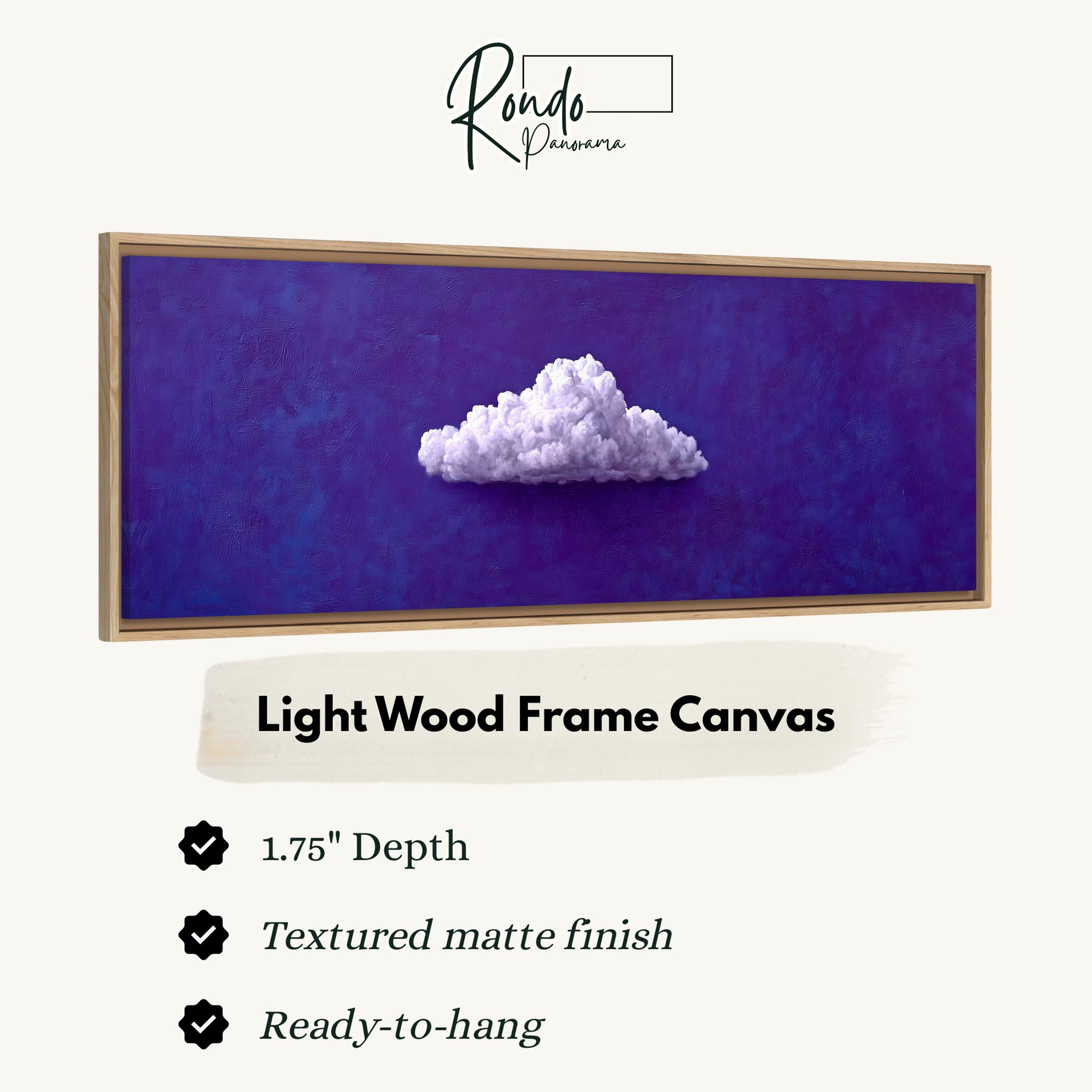 a light wood frame canvas with a single white cloud on a dark blue background.
