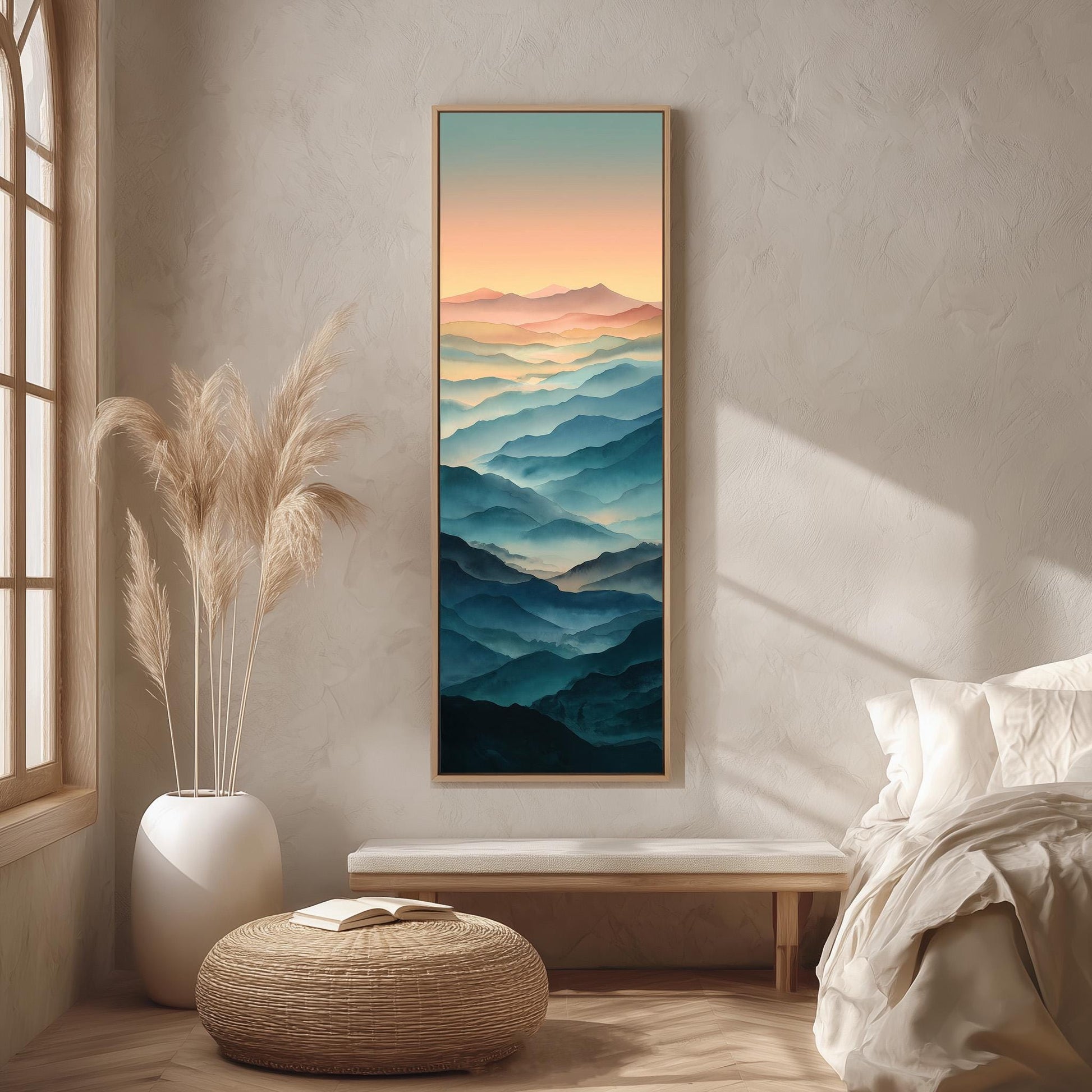 a serene bedroom setting with a large framed landscape painting hanging on the wall, depicting a mountain range with a gradient of colors. The painting is surrounded by a white bed, a white ottoman, and a potted plant, creating a harmonious and calming atmosphere.
