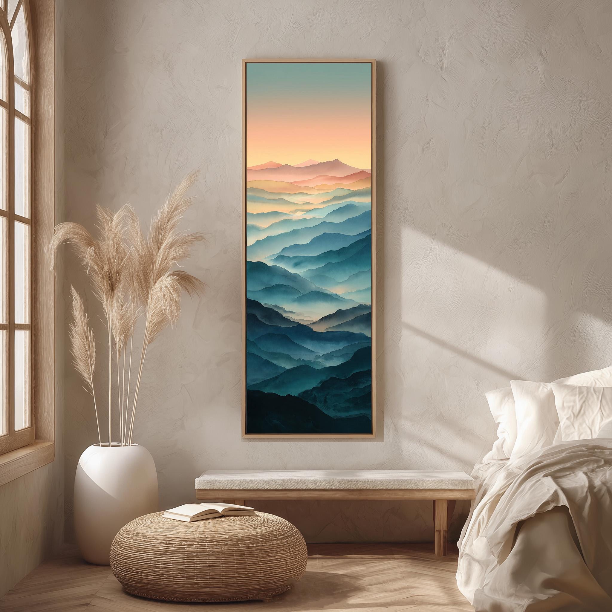 a serene bedroom setting with a large framed landscape painting hanging on the wall, depicting a mountain range with a gradient of colors. The painting is surrounded by a white bed, a white ottoman, and a potted plant, creating a harmonious and calming atmosphere.