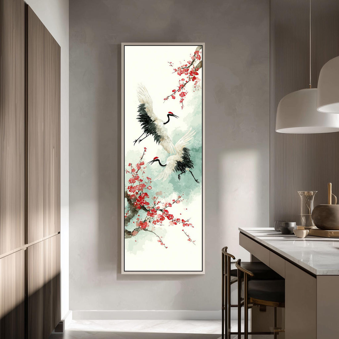 a large framed painting of two white birds with black and red accents, surrounded by red flowers, hanging on a wall in a modern kitchen.