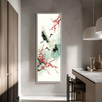 a large framed painting of two white birds with black and red accents, surrounded by red flowers, hanging on a wall in a modern kitchen.