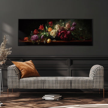 a large painting of a bouquet of flowers hanging on a wall above a black and white checkered sofa.