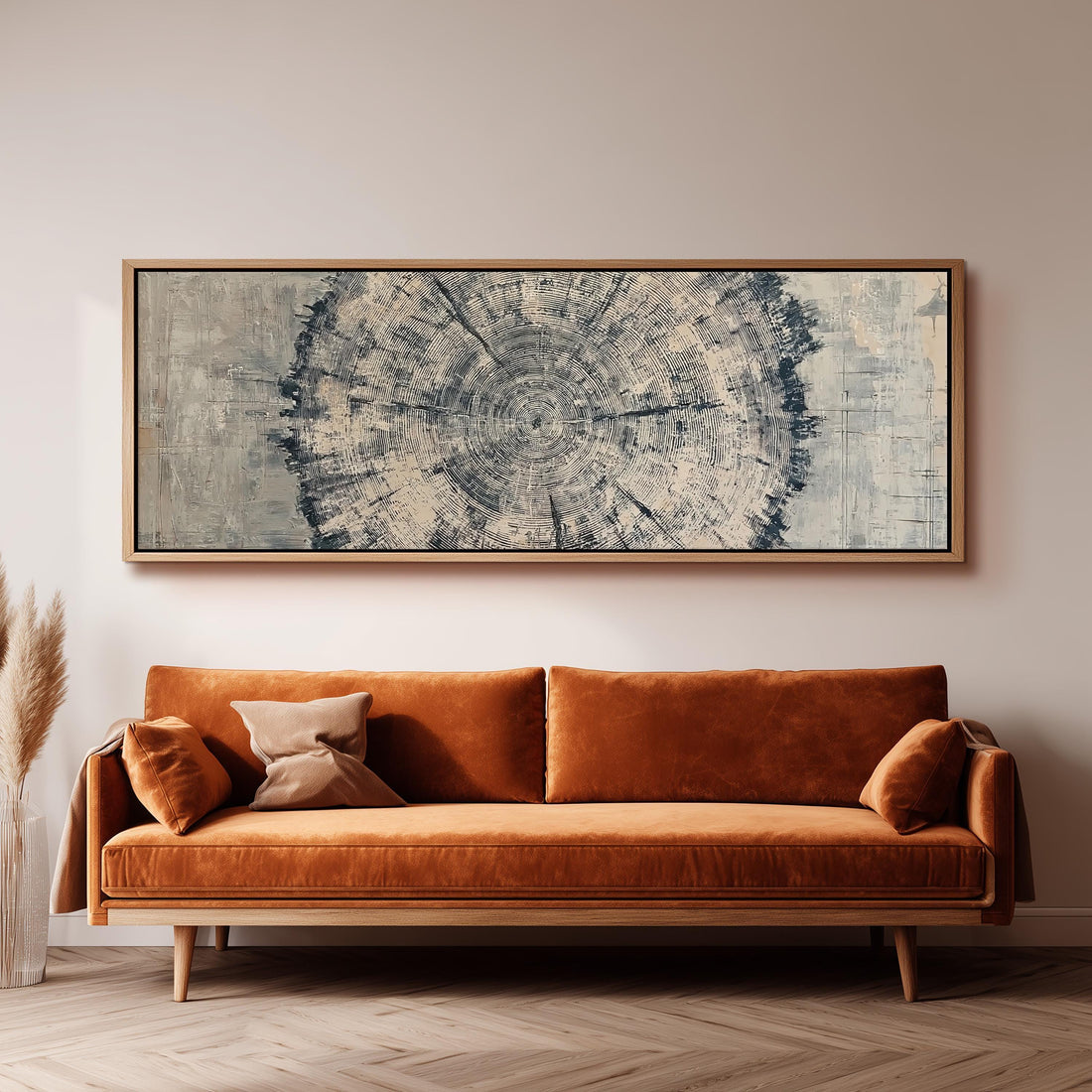 Navy ink tree ring long horizontal canvas print above a sofa in a living room