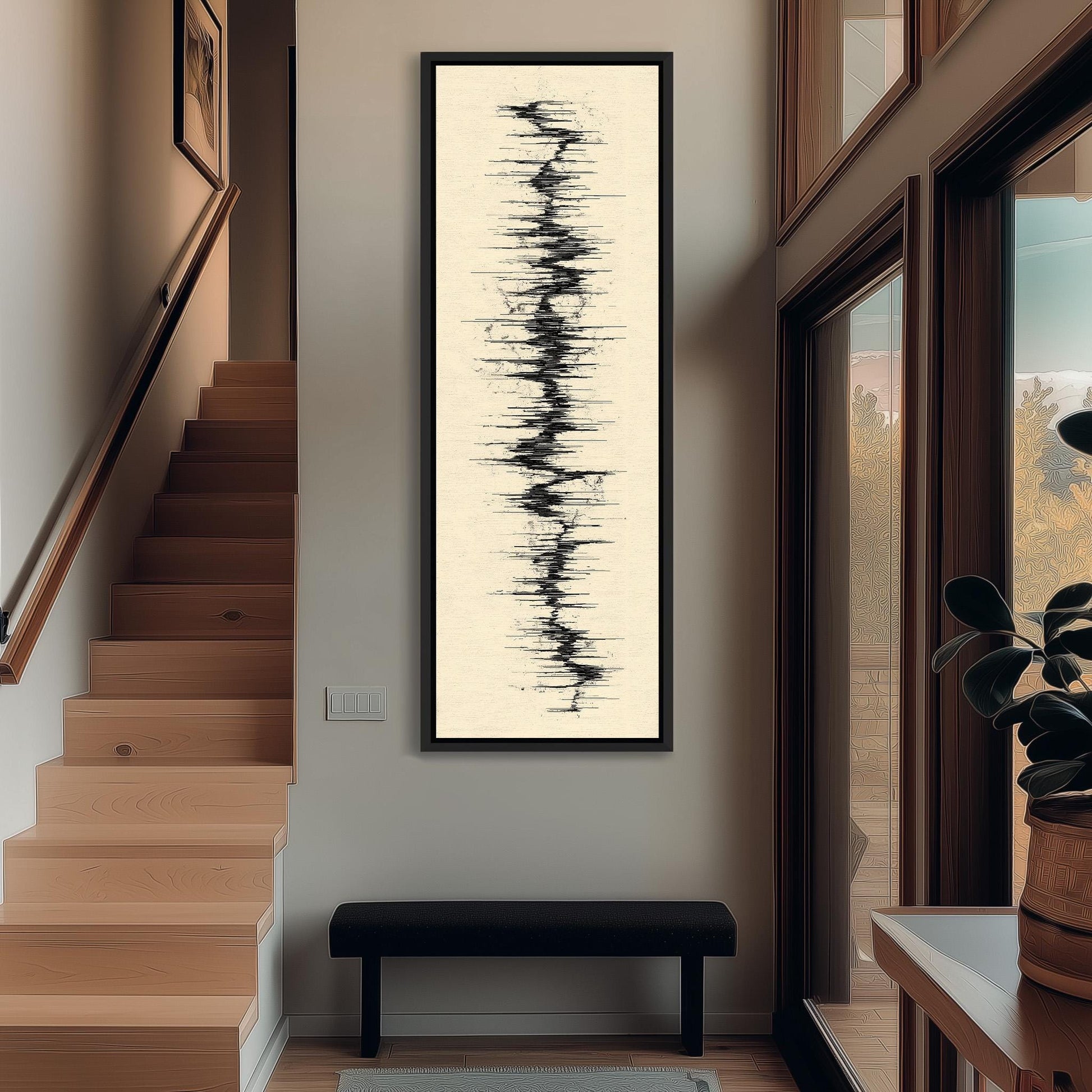 a hallway with a large abstract painting hanging on the wall, a wooden staircase, a black bench, and a plant in a pot.