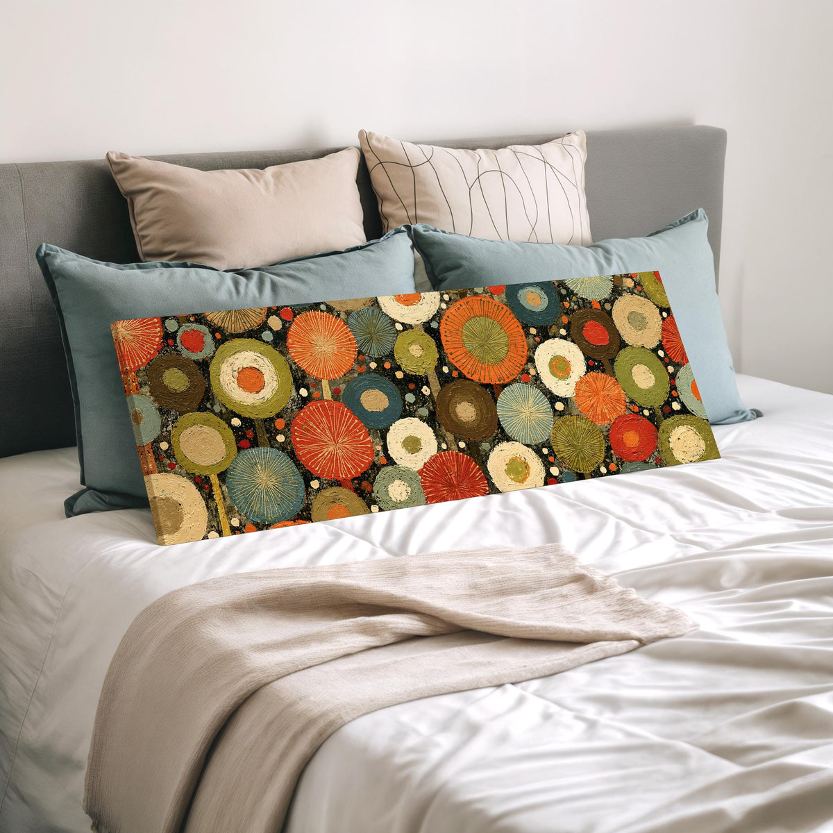 Layered circle dot pattern wide panoramic canvas print laid on a bed to show its size