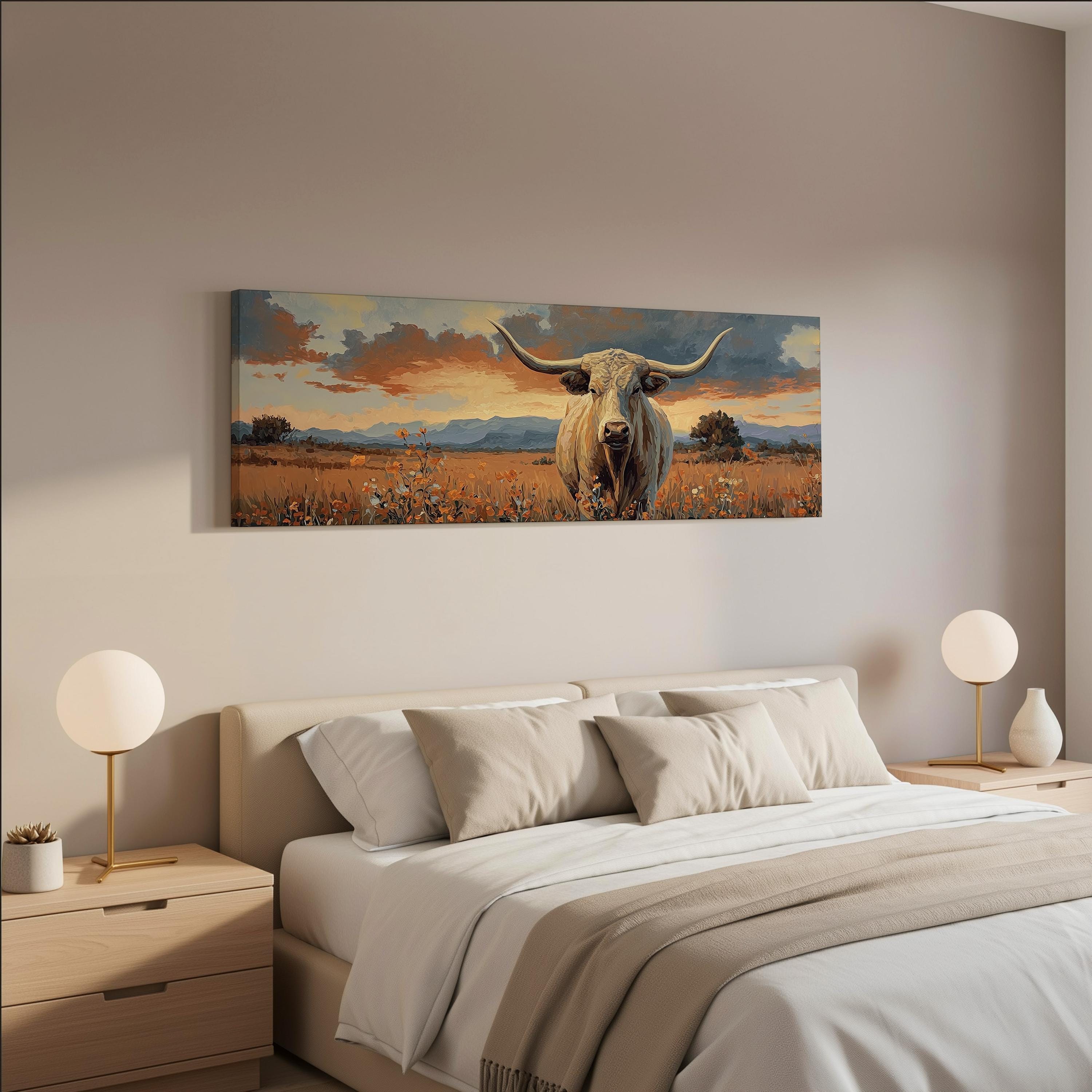 a bedroom with a large bed, two nightstands with lamps, and a painting of a bull with horns hanging on the wall above the bed.