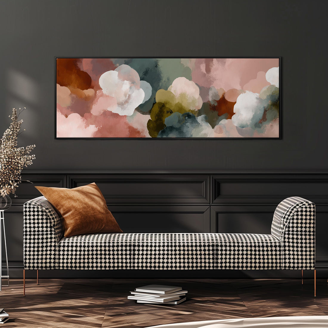 a large bed with a white comforter and a variety of colorful pillows. Above the bed, there is a large canvas print depicting a vibrant abstract painting of clouds in different colors.