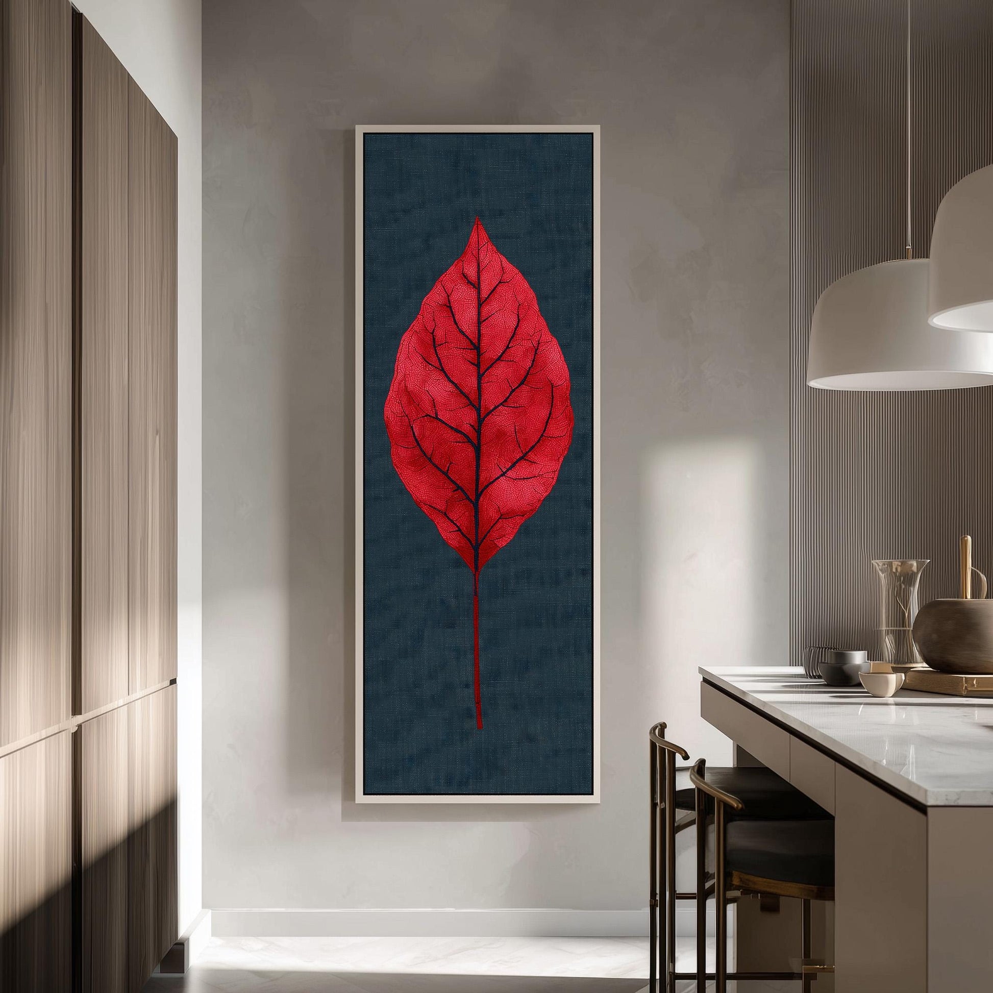 a large, vibrant red leaf hanging on a wall in a modern kitchen.