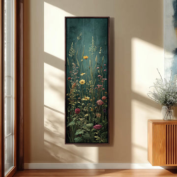 a large framed painting of a lush, colorful garden scene hanging on a wall.