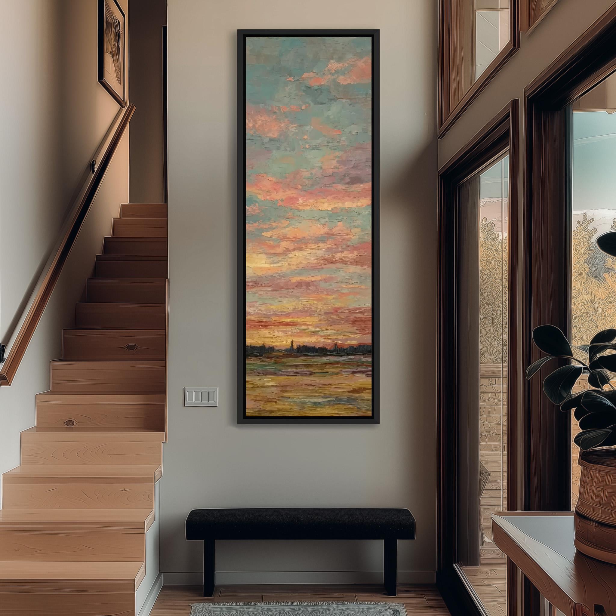 a large painting of a sunset hanging on the wall of a hallway. The painting is framed and appears to be the focal point of the space. The hallway has a wooden staircase leading up to the painting, and there is a bench in the foreground. The overall atmosphere of the image is warm and inviting, with the painting adding a touch of color and artistic interest to the space.