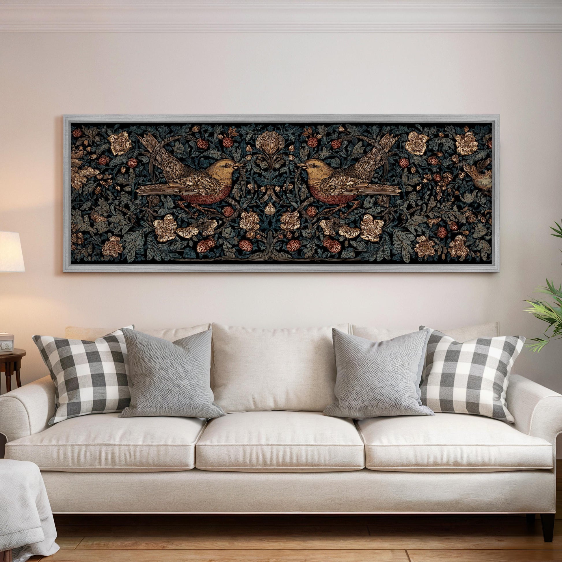 a large, ornate tapestry hanging on a white wall above a white sofa with decorative pillows.