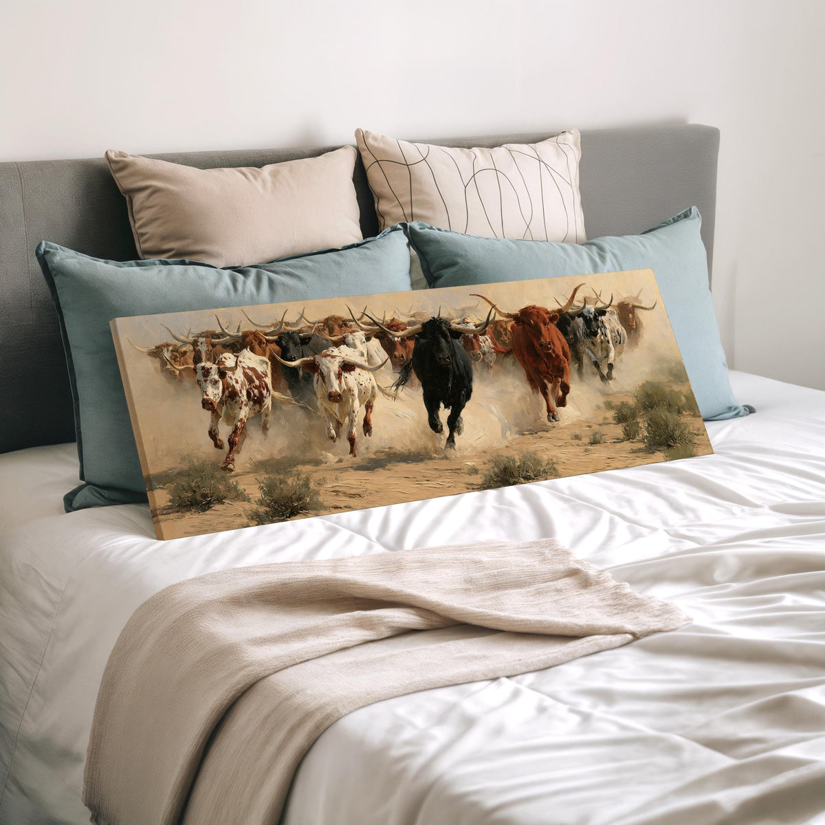 Charging longhorn herd wide panoramic canvas print laid on a bed to show its size