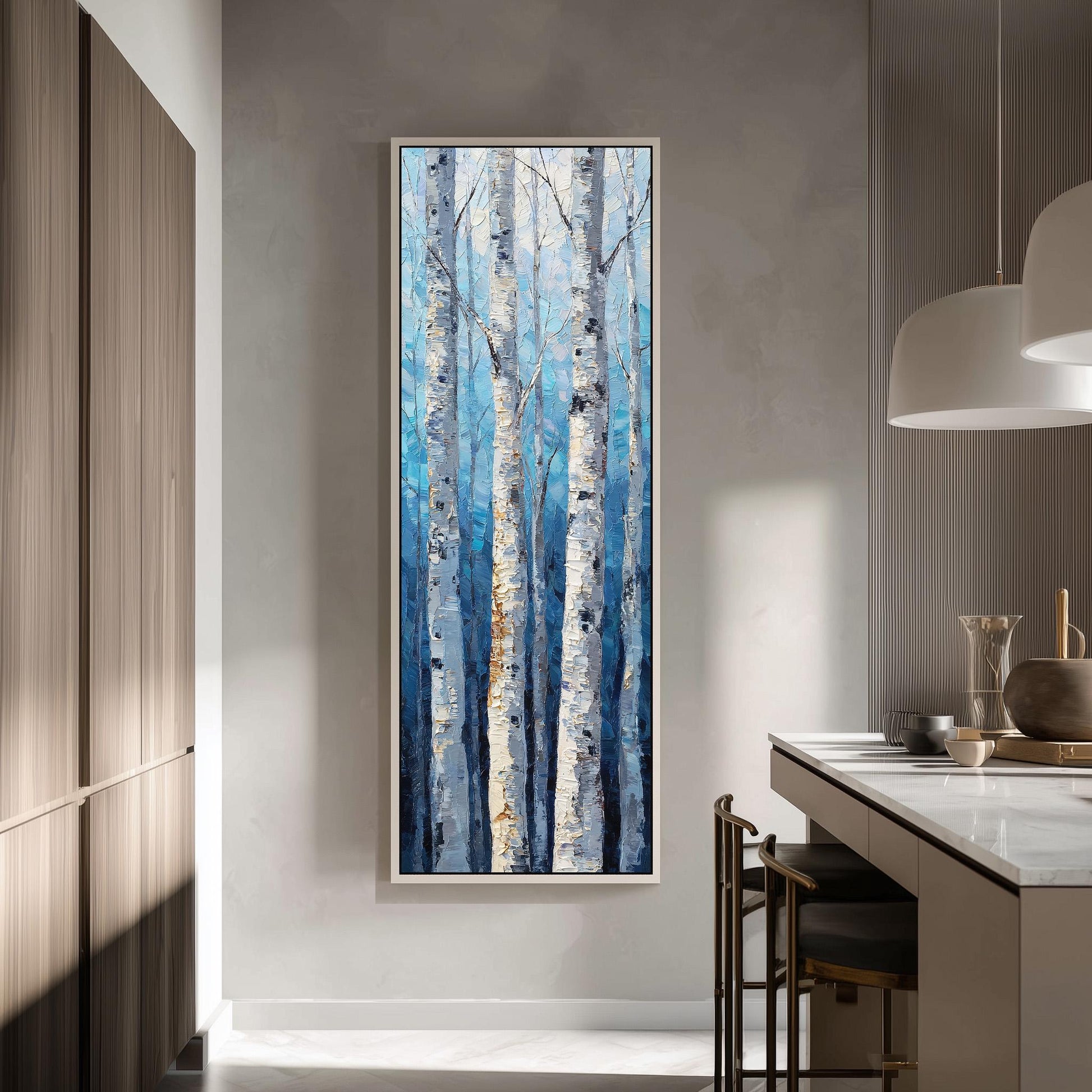 a large painting of birch trees with a blue and white color scheme, hanging on a wall in a modern kitchen.