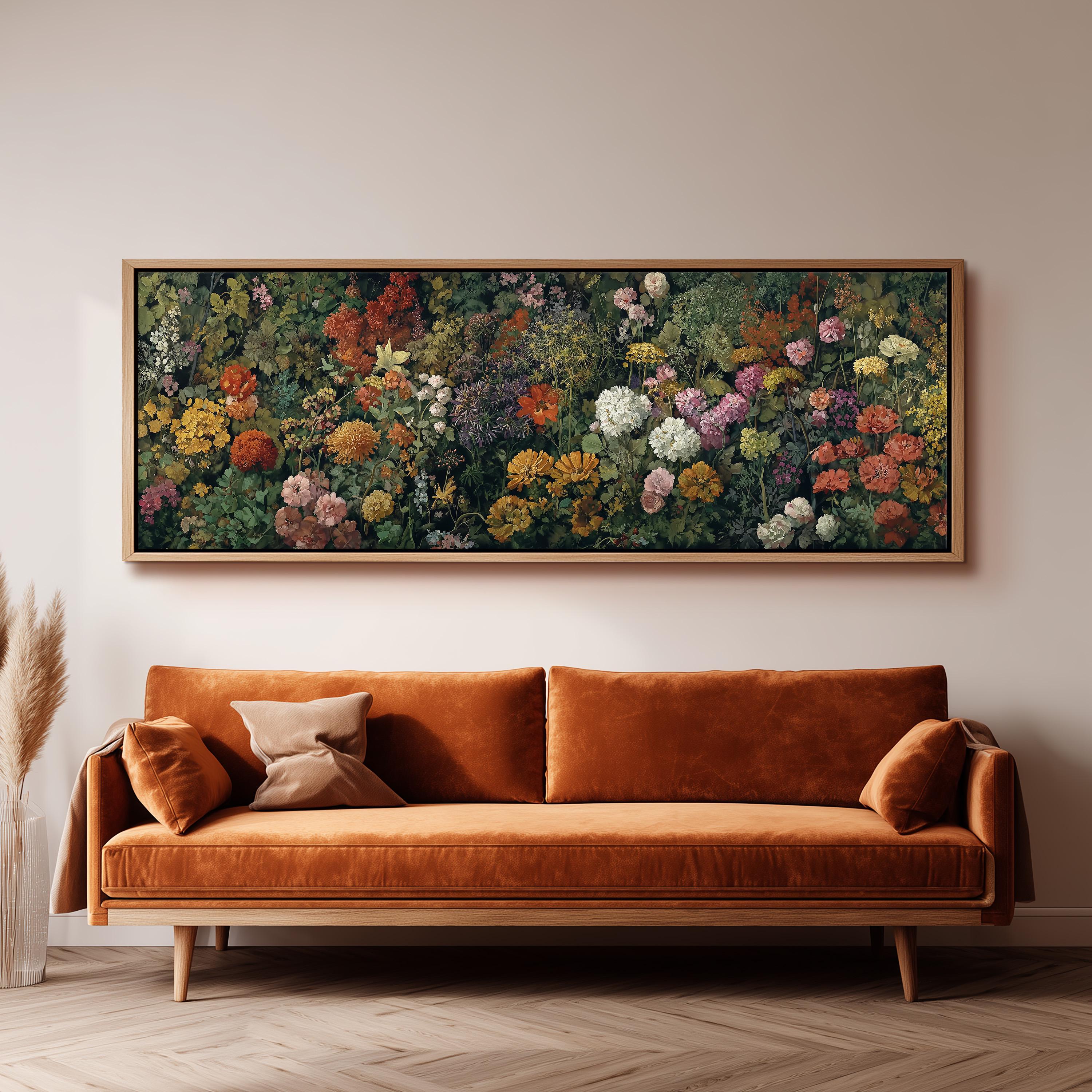 a large, framed painting of a vibrant garden scene hanging on a wall above a brown sofa.