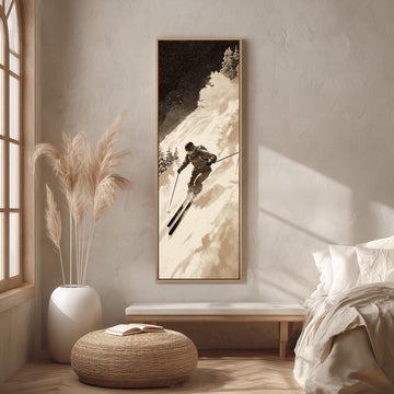 a cozy bedroom scene with a large framed picture of a skier on the wall, a white bed with a white pillow, a white ottoman, and a potted plant.