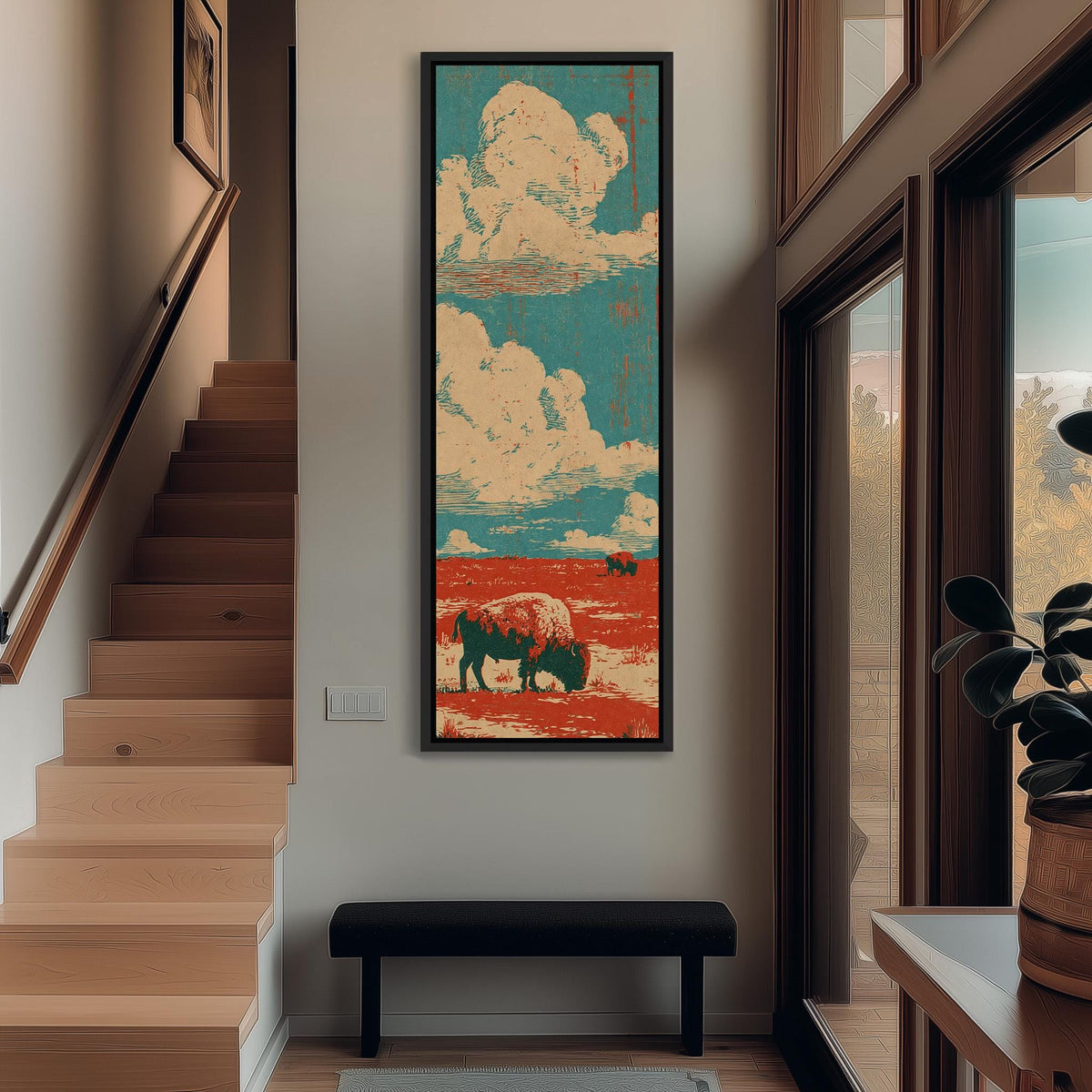 Bison on a red prairie under clouds tall narrow canvas print beside a staircase in an entryway