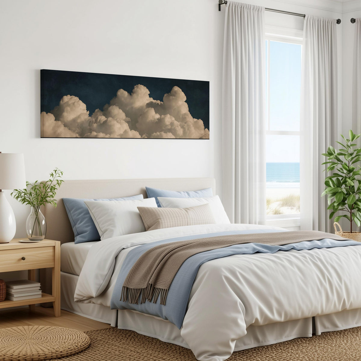 Cumulus clouds against a dark night sky panoramic canvas print above a bed in a coastal bedroom