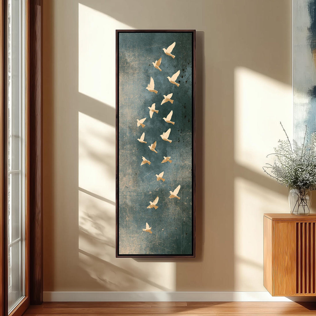 Golden birds flying on slate blue long vertical canvas print in a sunlit living space