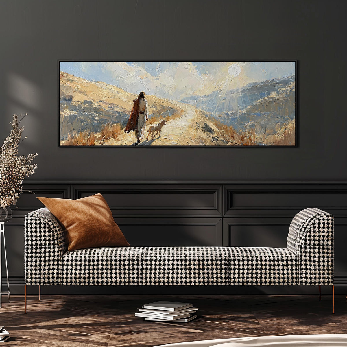 Jesus walking a sunlit hillside path with a sheep wide panoramic canvas print above a bench in a dark living room