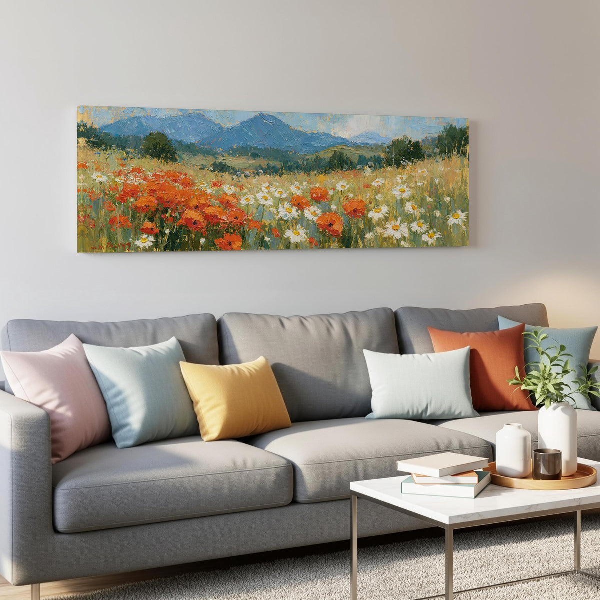 Alpine poppy and daisy meadow panoramic canvas print above a grey sofa in a living room