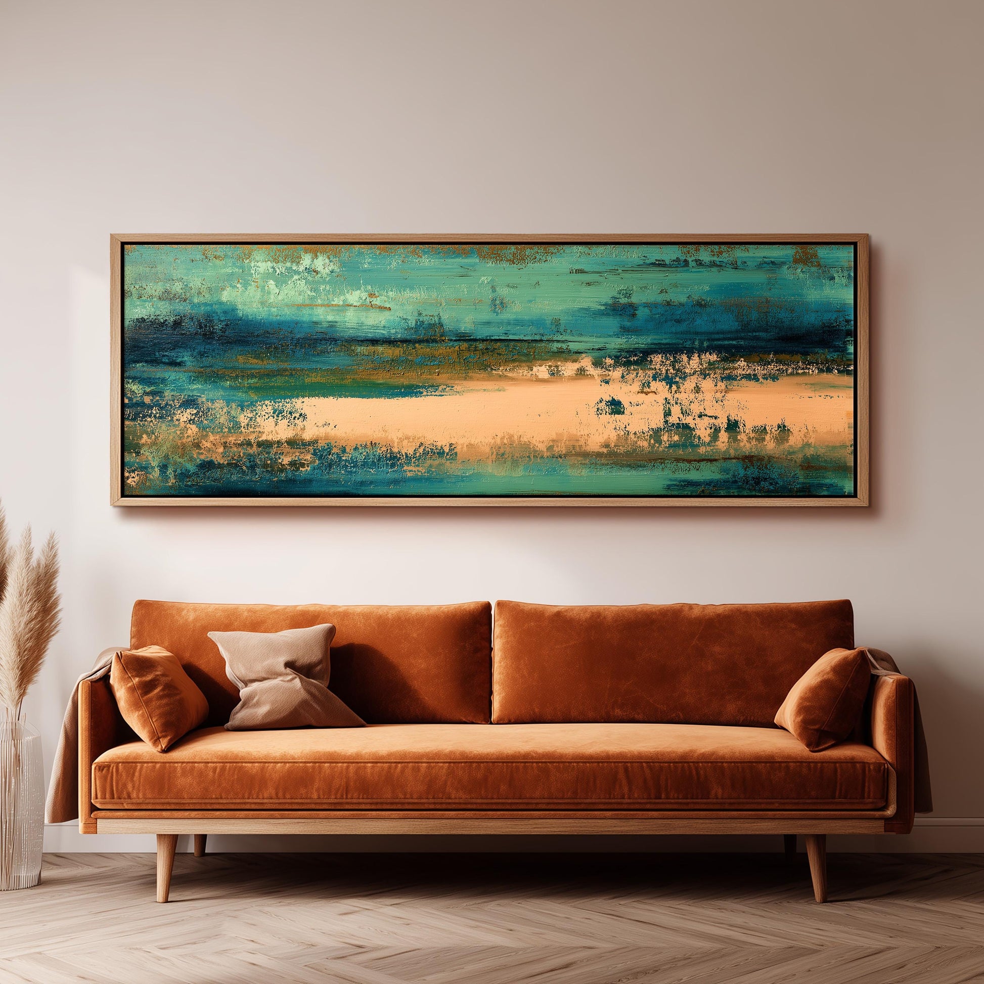 a large, rectangular painting hanging on a white wall above a brown sofa with orange cushions.