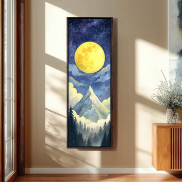 a large, framed painting of a mountain landscape with a bright yellow moon in the night sky, surrounded by clouds and stars.