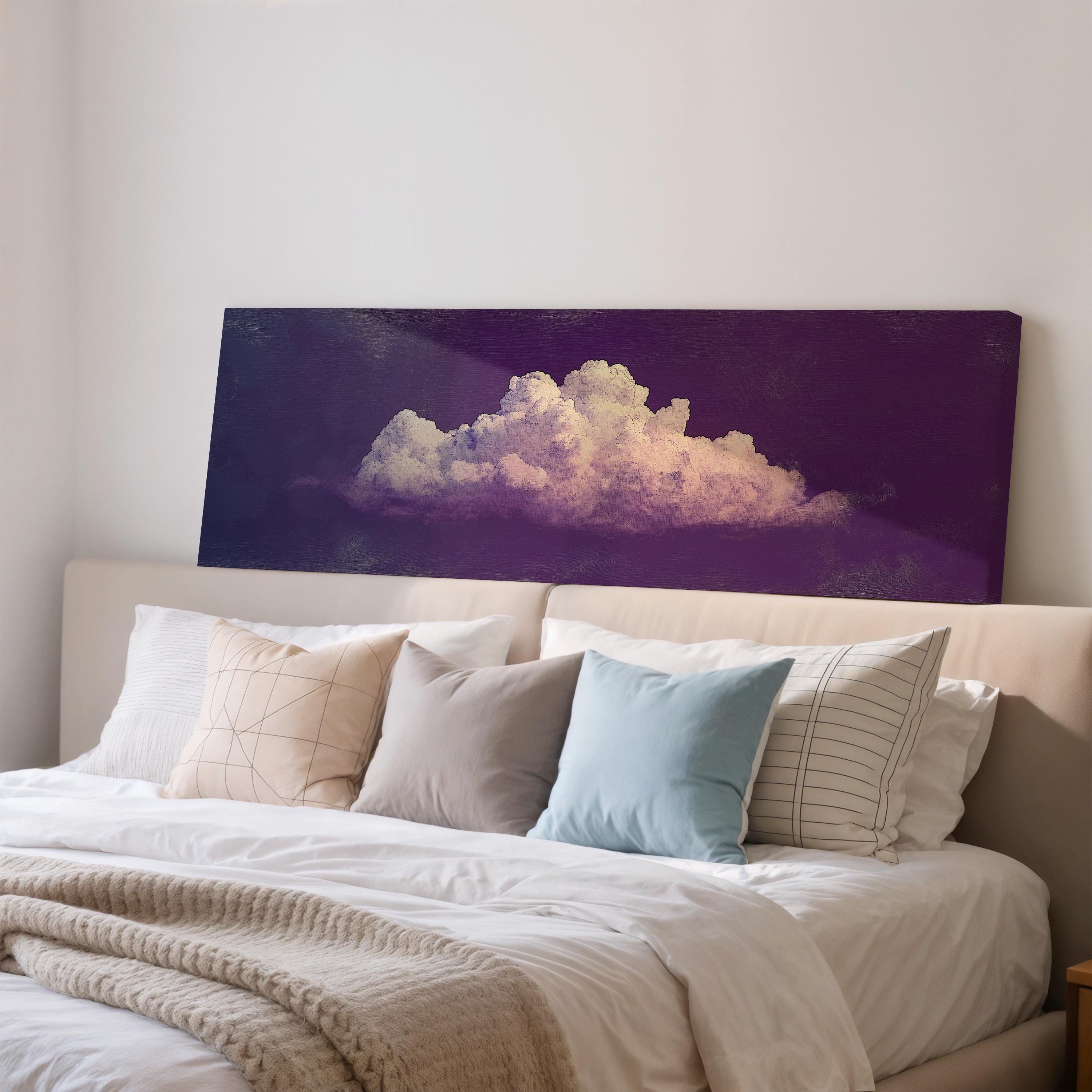 a large bed with white sheets and pillows, and a large canvas print of a cloud on the wall above it.