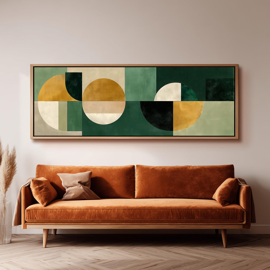 a large abstract painting hanging on a wall above a brown sofa with orange cushions.