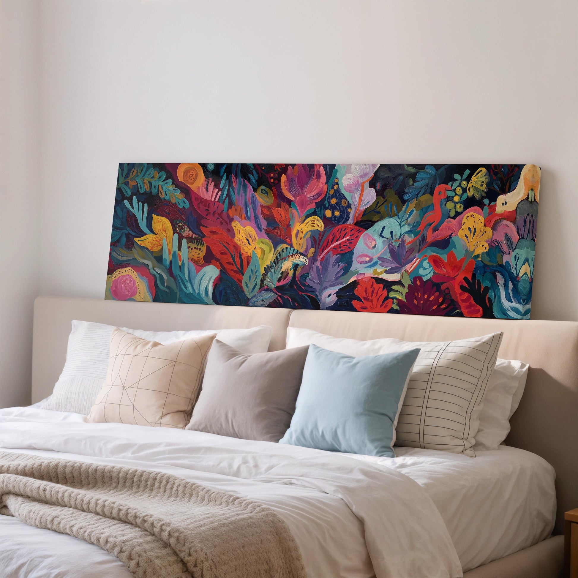 a large, colorful painting of a tropical garden hanging on a wall above a bed with white bedding and pillows.