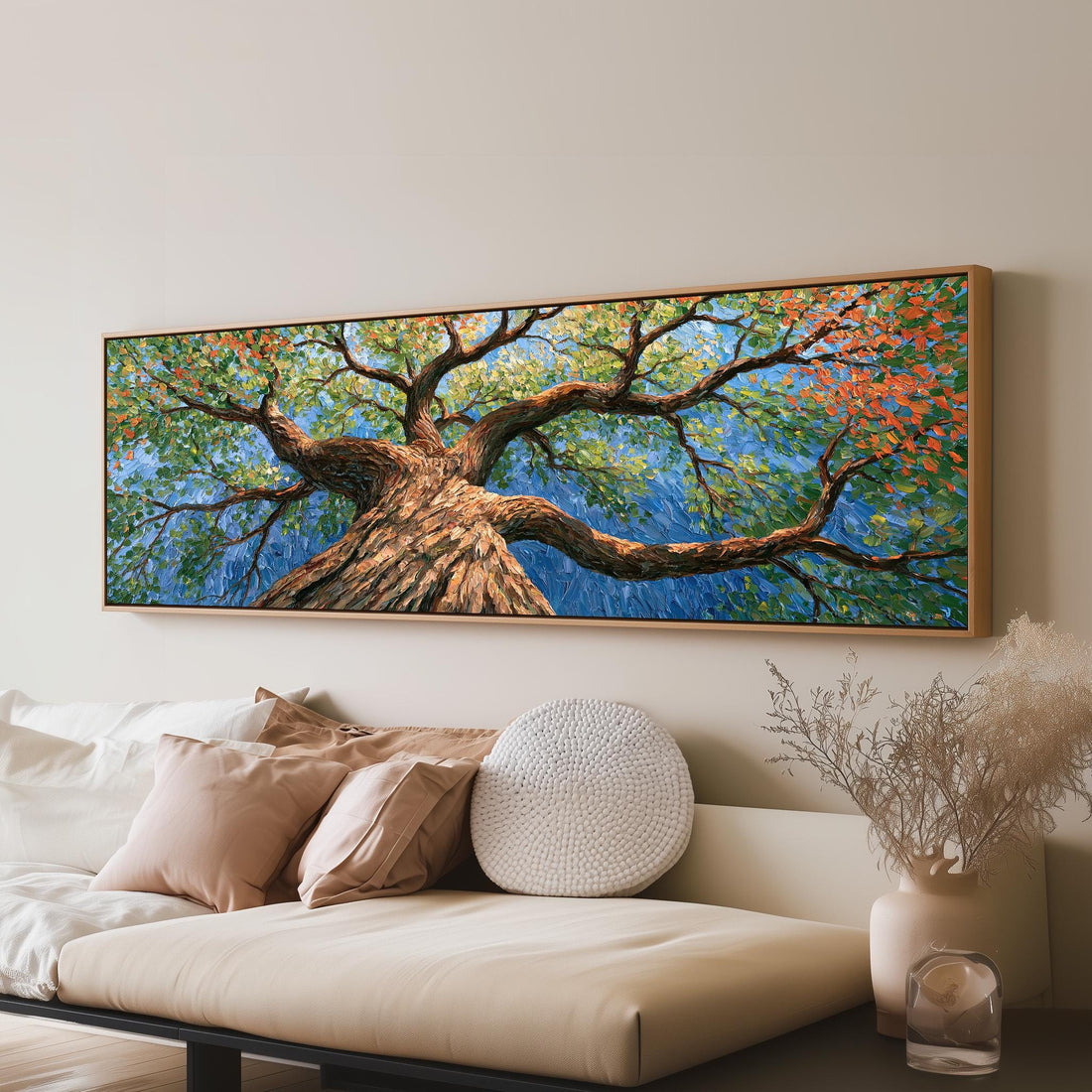 Vivid autumn tree canopy from below long horizontal canvas print above a sofa in a living room