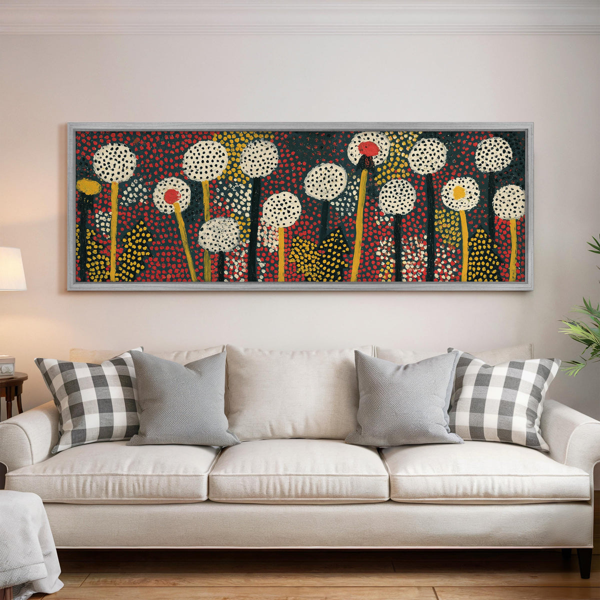 Dotted dandelion meadow panoramic canvas print above a white sofa in a bright living room