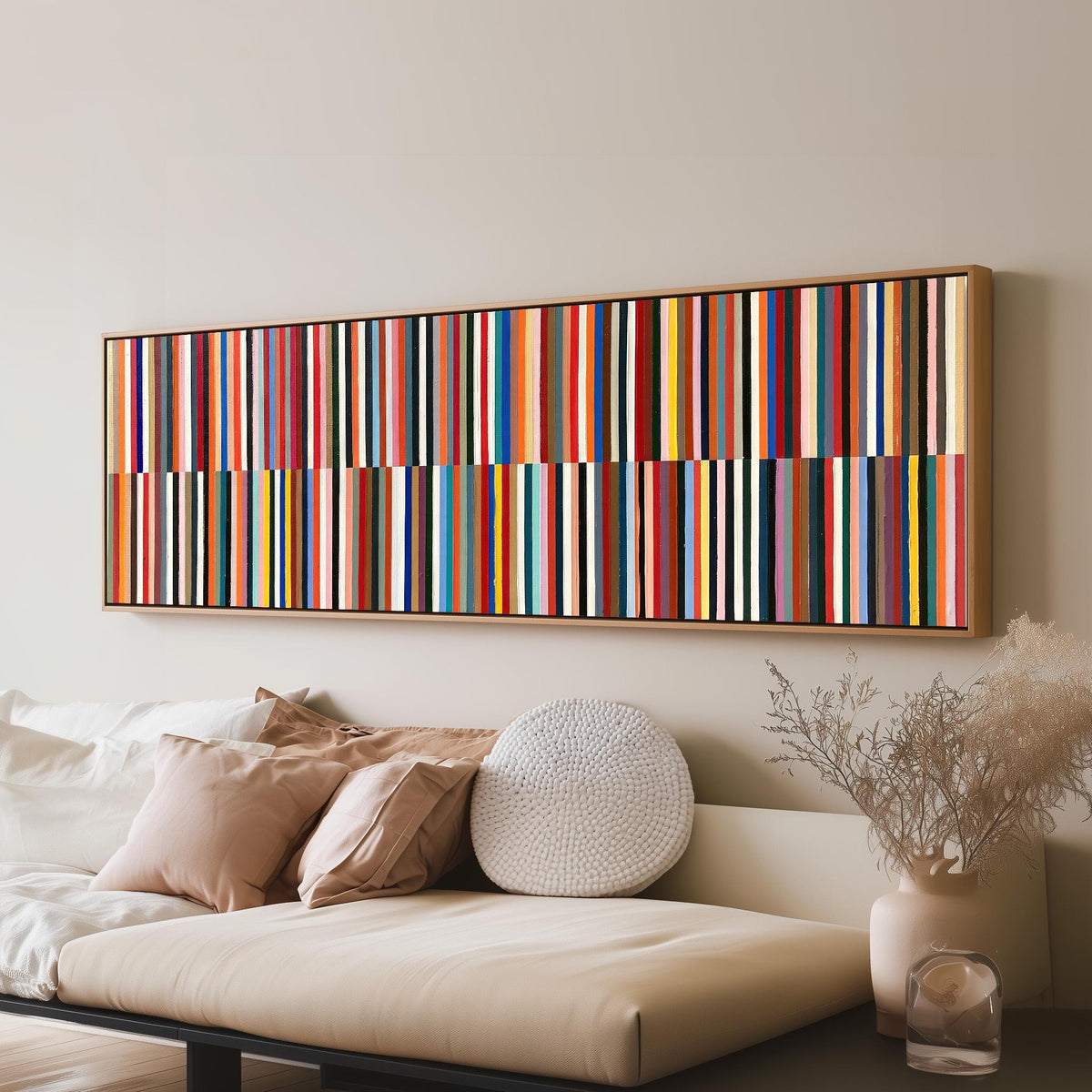 Two bands of colorful stripes long horizontal canvas print above a sofa in a living room