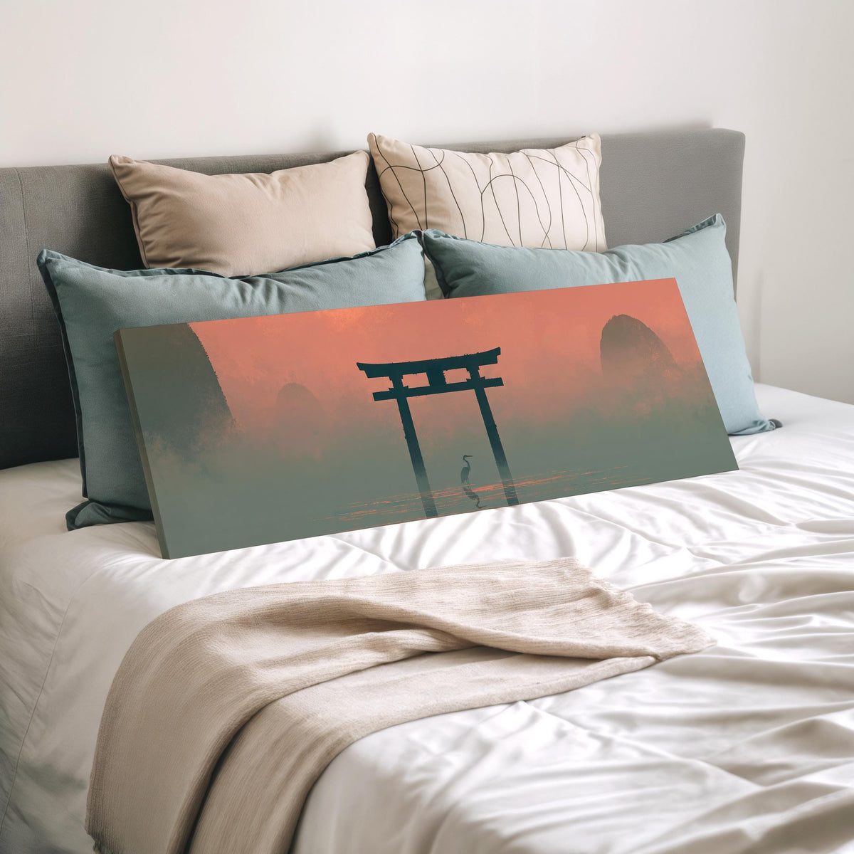Torii gate and heron in pink mist wide panoramic canvas print laid on a bed to show its size