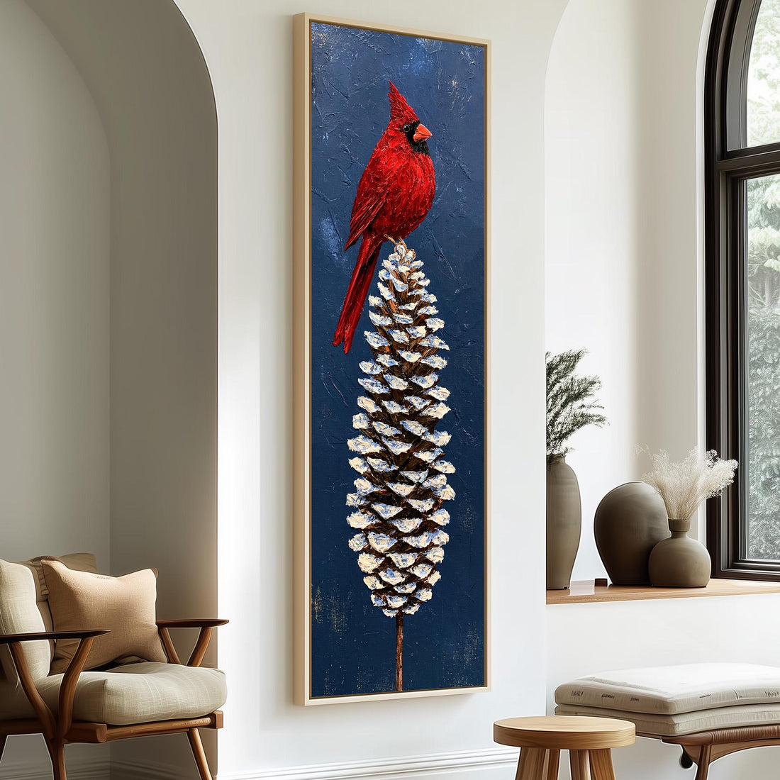 Red cardinal perched on a snowy pinecone long vertical canvas print in a sunlit living space
