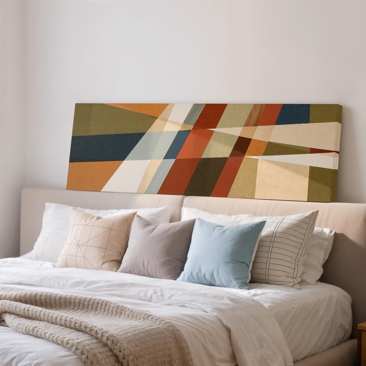 Rust and navy diagonal color blocks wide panoramic canvas print above a bed in a bedroom