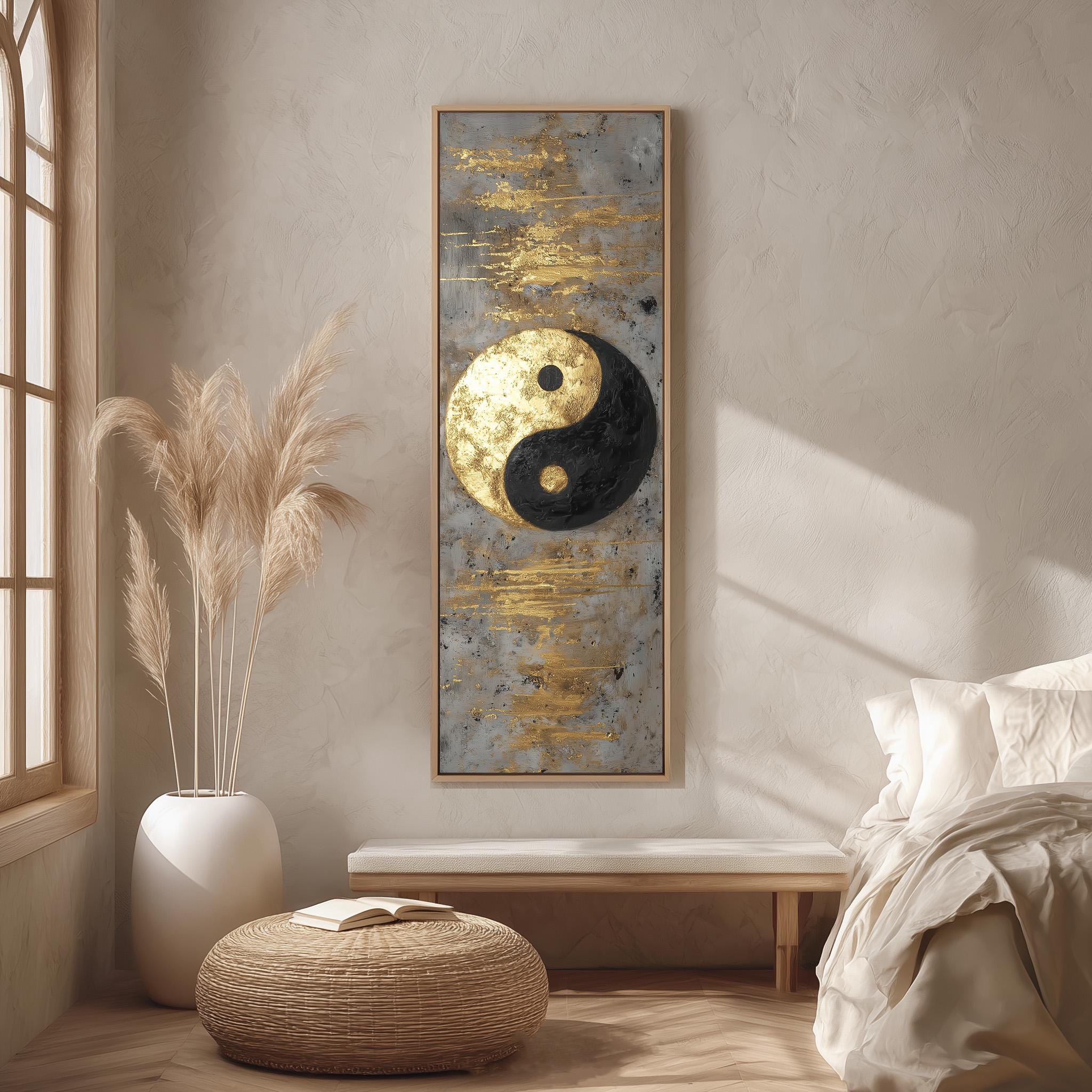 a minimalist bedroom setting with a large framed painting of a yin and yang symbol on the wall, a white bed with a white pillow, a white vase with tall potted plants, and a woven ottoman.