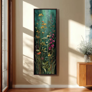 a large, framed painting of a lush, colorful garden scene hanging on a wall.