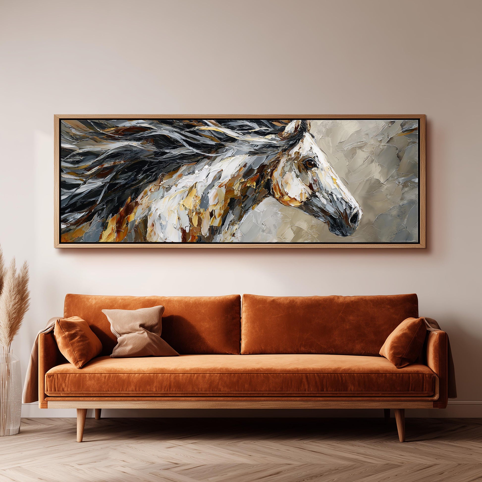 a large, vibrant painting of a horse's head hanging on a wall above a brown sofa.