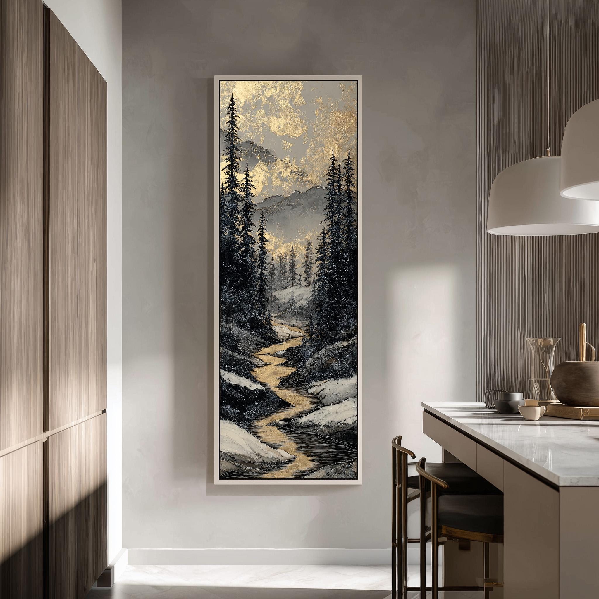 a large, framed painting of a snowy mountain landscape hanging on a wall in a modern kitchen.