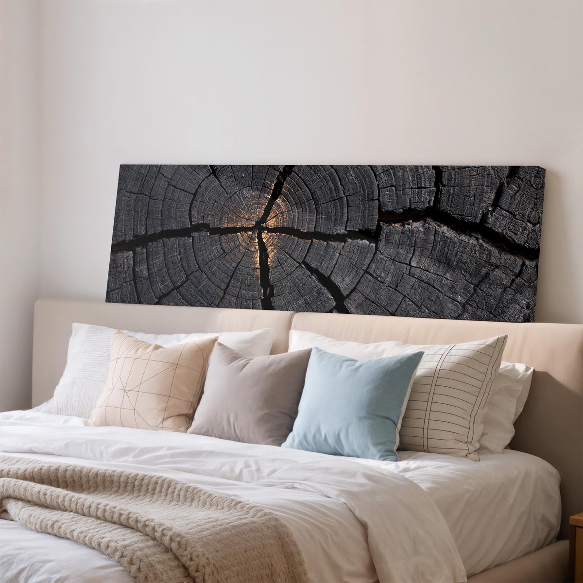 Charcoal tree ring cross section wide panoramic canvas print above a bed in a bedroom