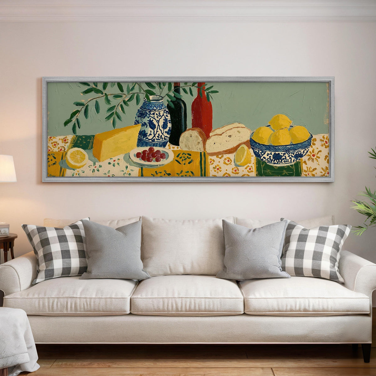 Cheese, wine and lemon spread panoramic canvas print above a white sofa in a bright living room