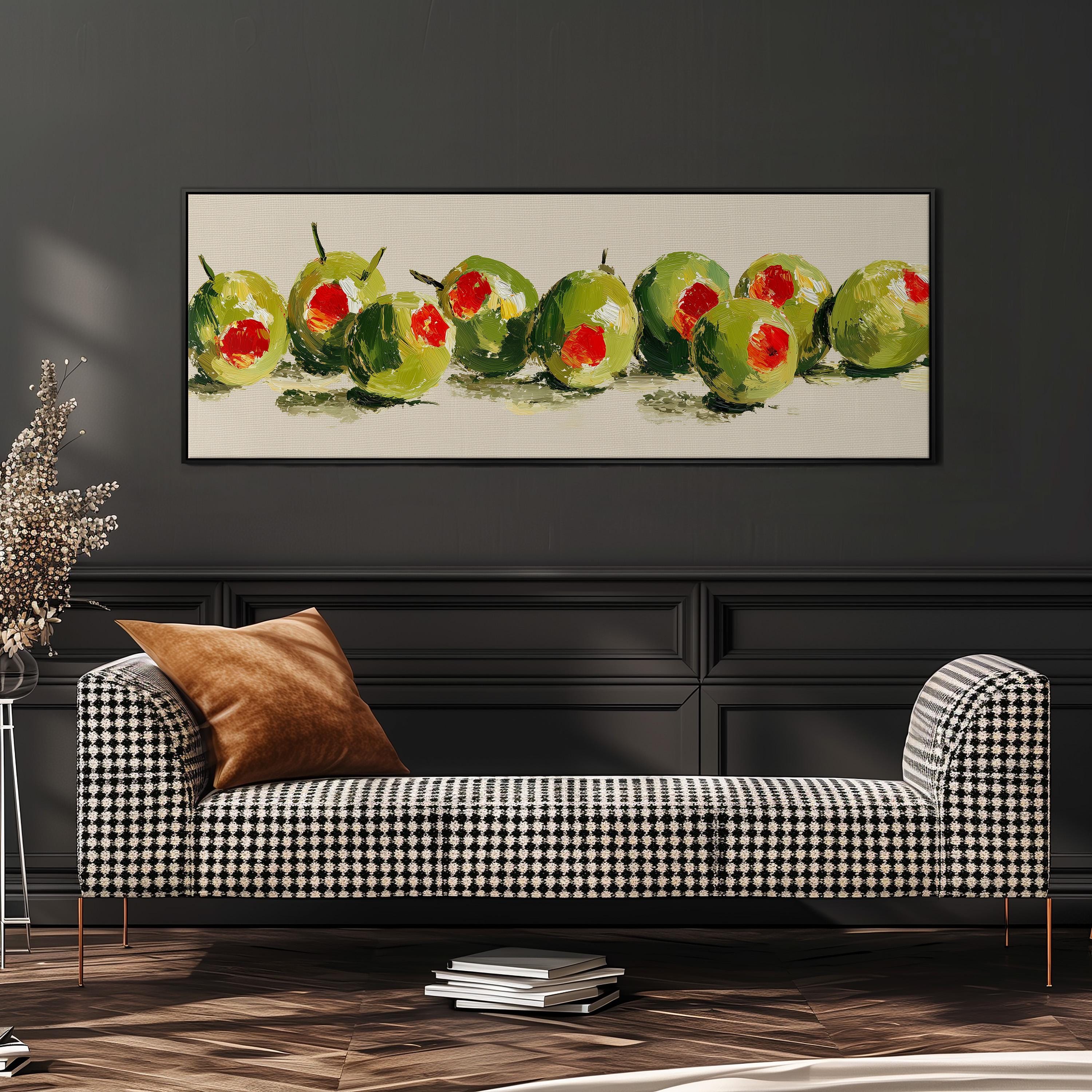 a checkered sofa with a brown throw pillow, and a framed painting of green olives with red centers hanging on the wall above it.