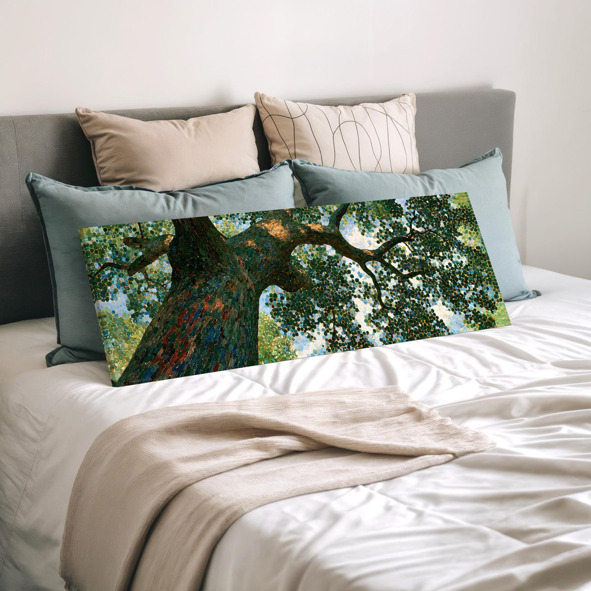 Looking up into an oak canopy wide panoramic canvas print laid on a bed to show its size