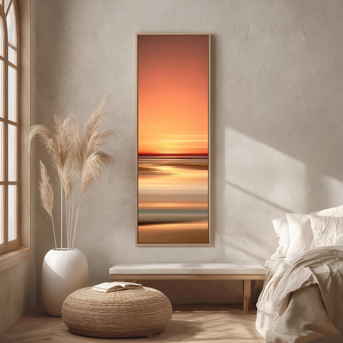a serene bedroom scene with a large window, a white bed, a woven ottoman, and a framed landscape painting of a sunset over the ocean.