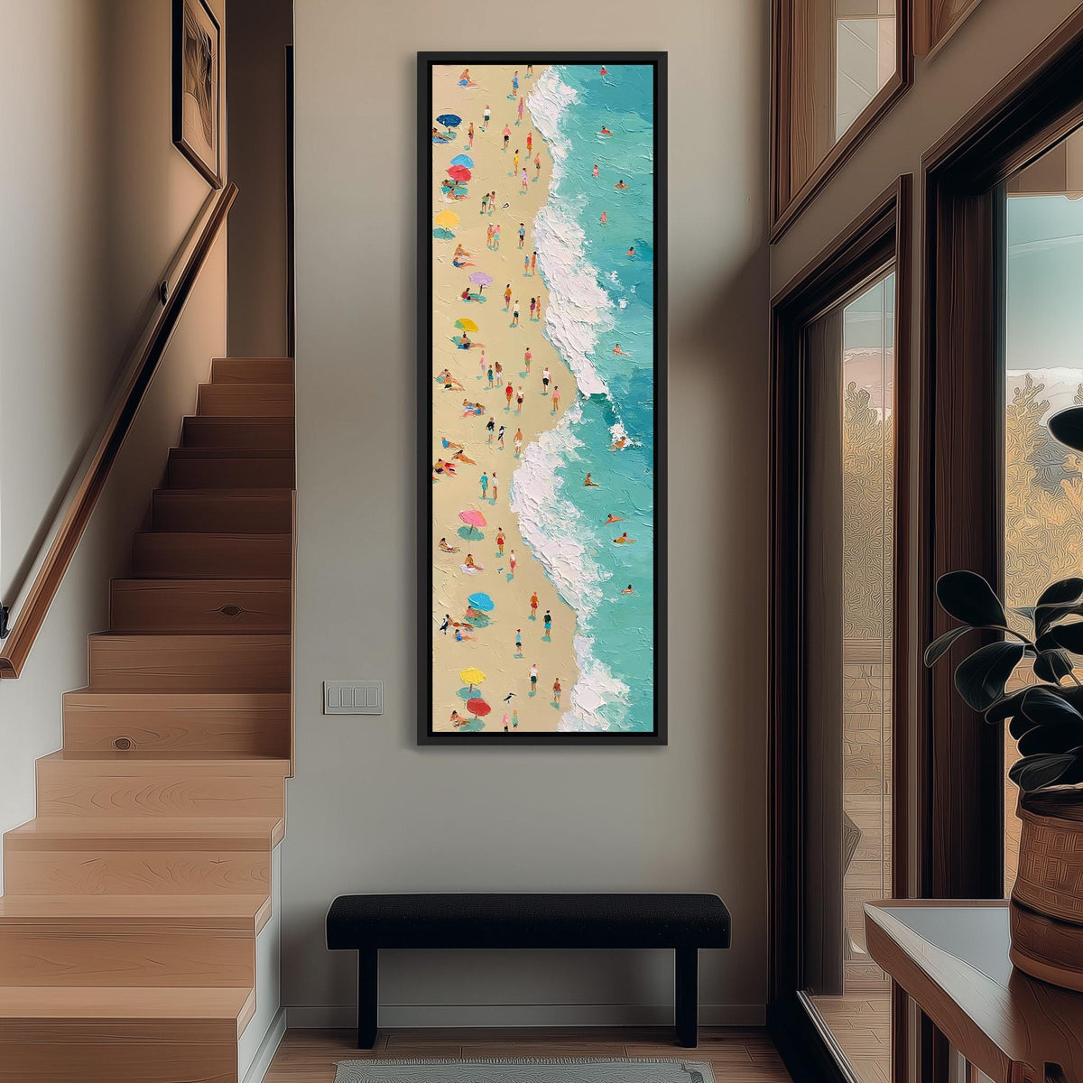 Busy beach and turquoise surf from above tall narrow canvas print beside a staircase in an entryway