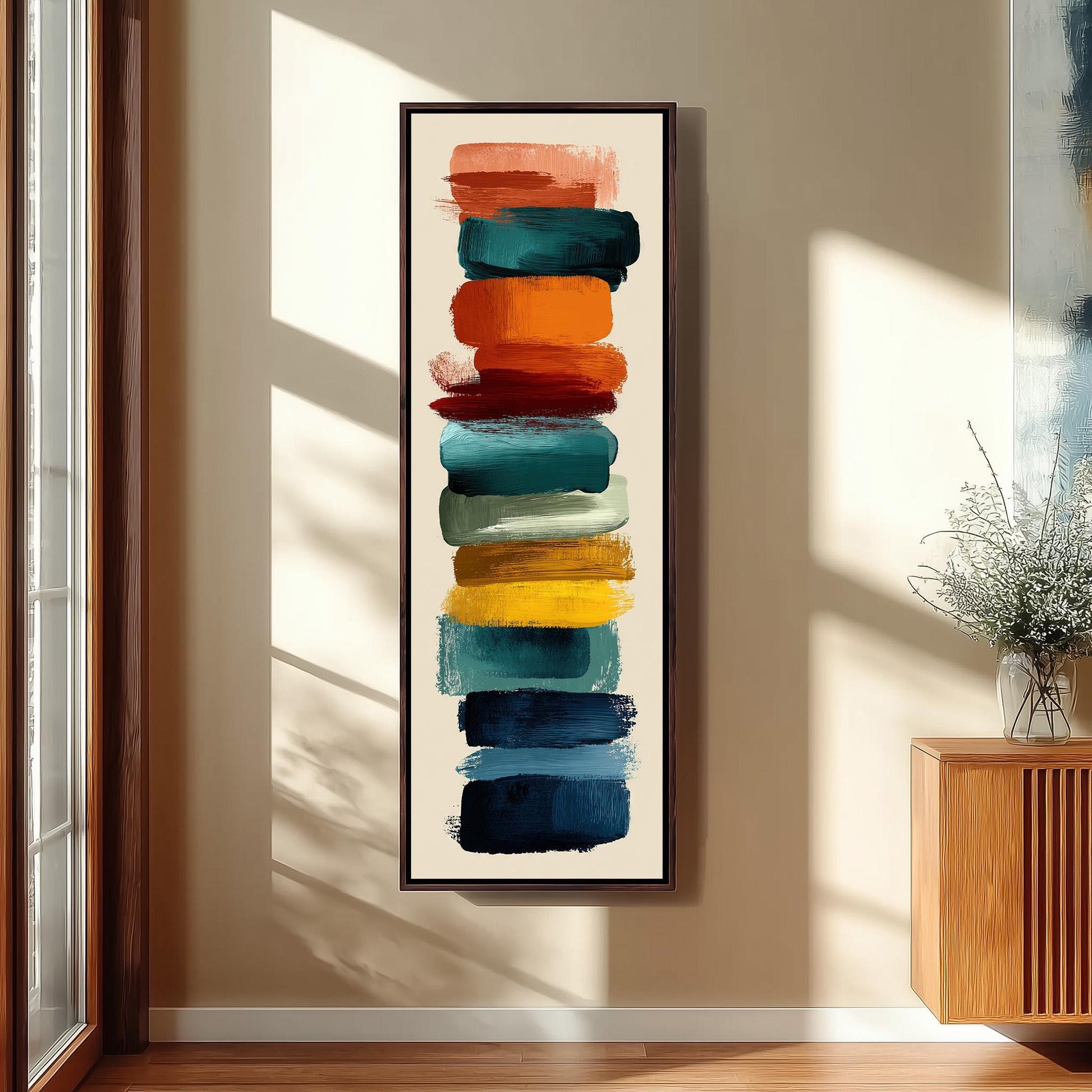 a vibrant abstract painting hanging on a wall, with a wooden cabinet and a vase of flowers in the background.