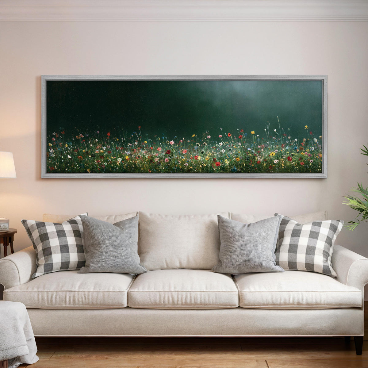 Wildflower field under a misty teal sky panoramic canvas print above a white sofa in a bright living room