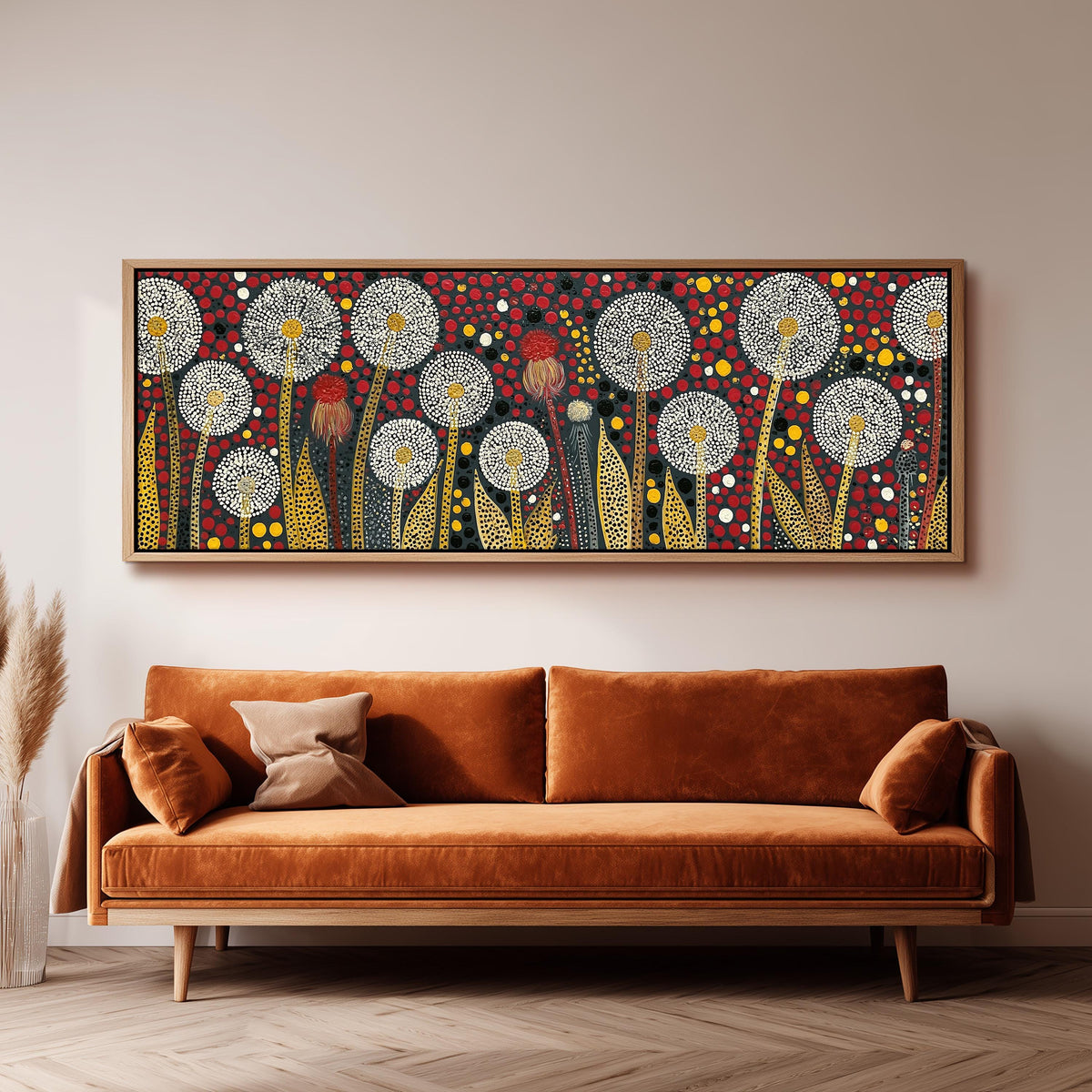 Dotted dandelions on deep red panoramic canvas print above a sofa in a living room
